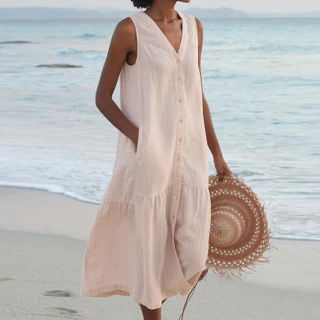 Women's sleeveless midi dress with full button front, v-neck, and tiered skirt for a casual summer look.