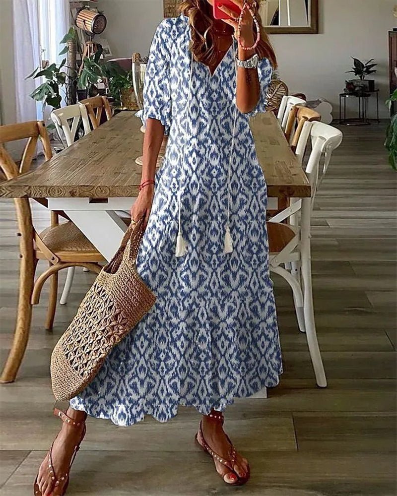 Women's boho midi dress with flattering a-line, v-neck, & long lantern sleeves. Geometric print, flowy.