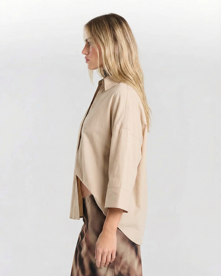 Lightweight relaxed fit women's oversized button shirt. Comfortable modern casual blouse.