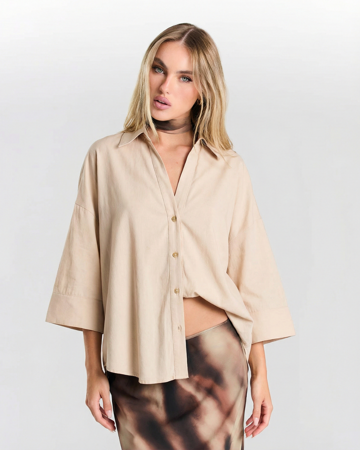Women's relaxed oversized button-down shirt. Lightweight casual blouse for everyday fashion.