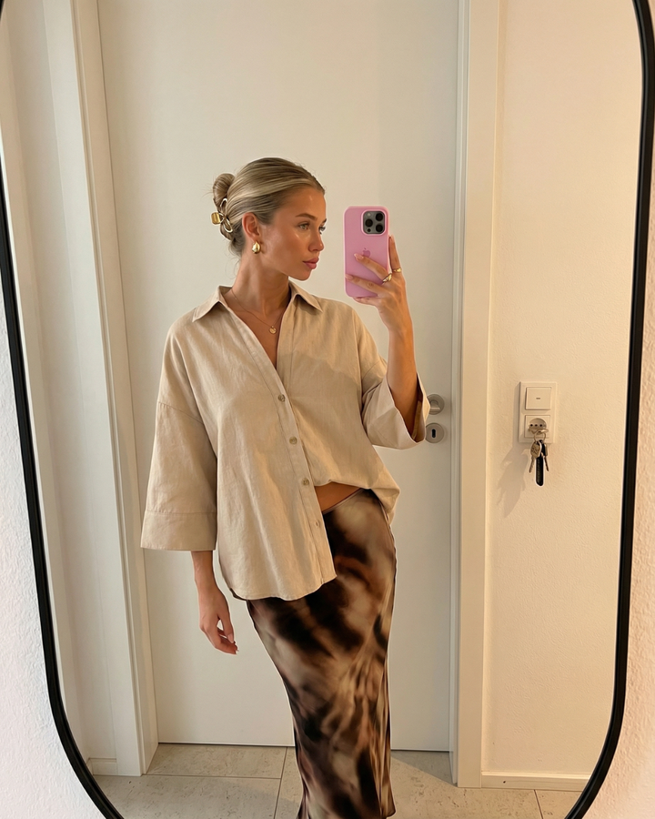 Chic women's oversized button shirt. Versatile long-sleeve blouse for spring & summer casual outfits.