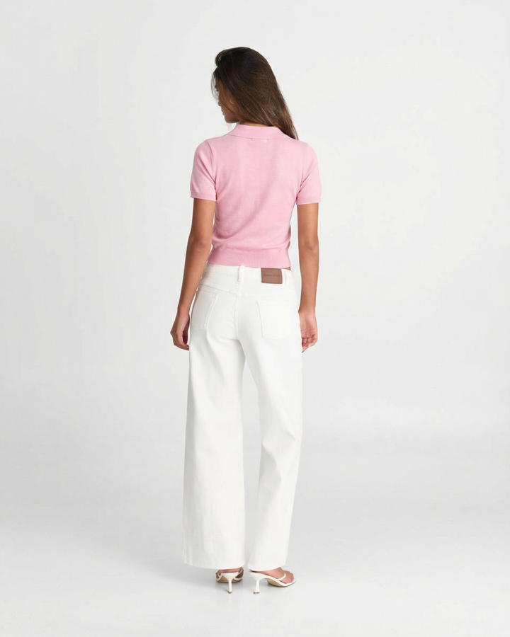 Soft knit short sleeve polo top for women, slim fit design offering a classic and elegant style.