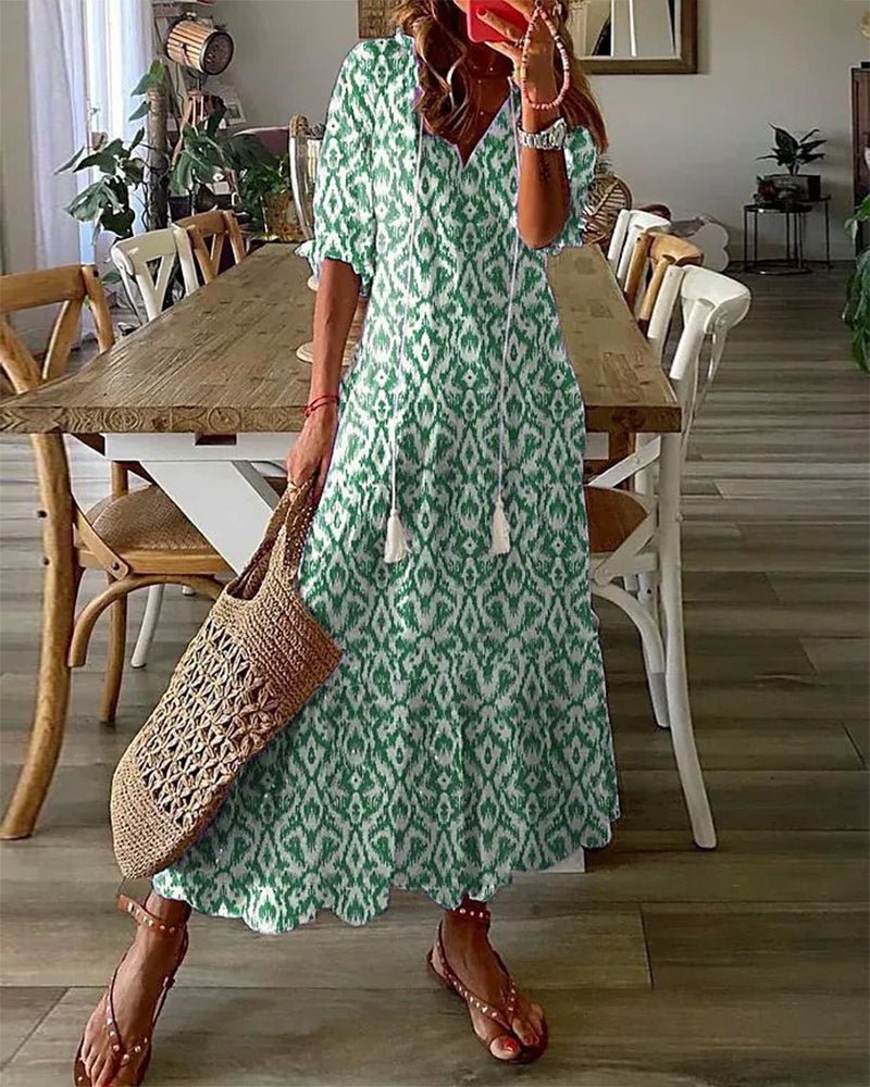 Stylish bohemian summer midi dress for women. Casual flowy v-neck, a-line with geometric print.