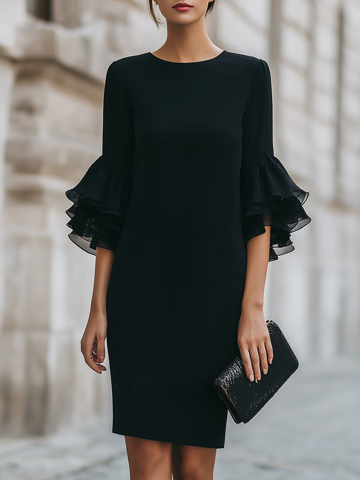 Women's formal black midi dress, perfect as elegant mourning attire with chic ruffled sleeves and modest knee-length hem.
