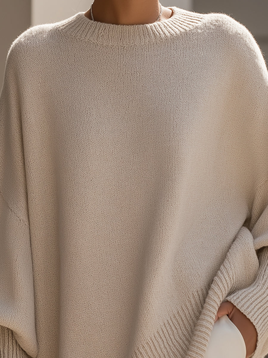 Relaxed fit women's oversized sweater. Soft knit long sleeve for ultimate comfort & chic winter style.