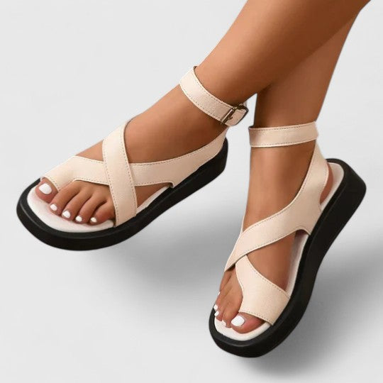 Elegant flat women's sandals for summer comfort and style.