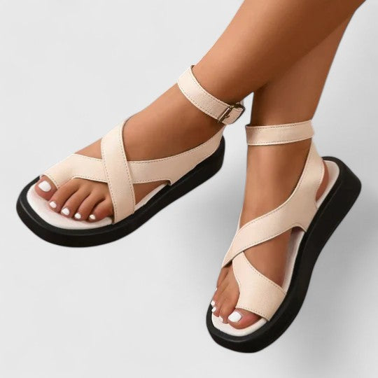 Comfortable ladies' flat sandals with adjustable straps, perfect for summer wear.