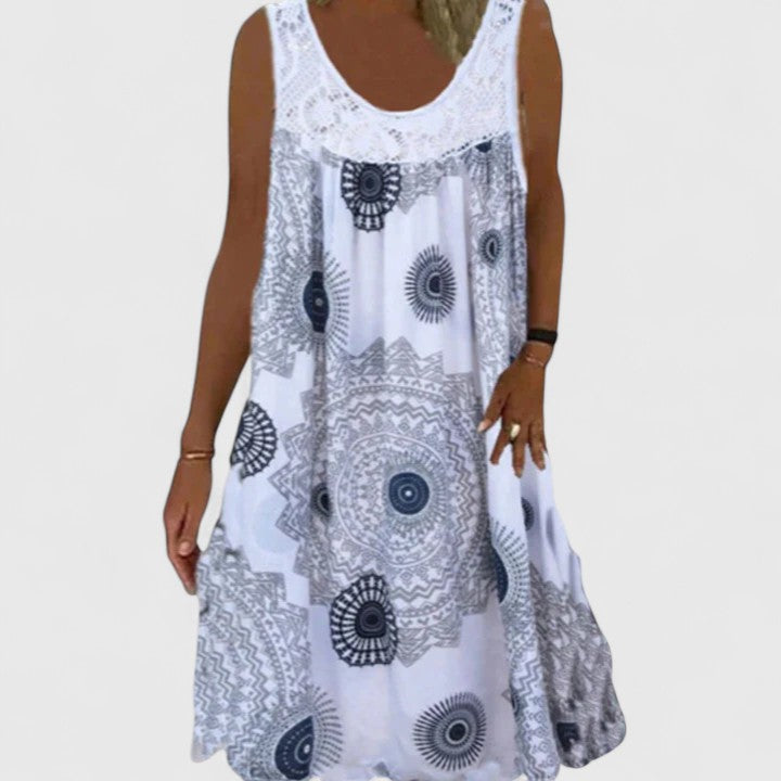 Vibrant ethnic mandala print on a flowy women's boho summer dress, perfect for warm weather.