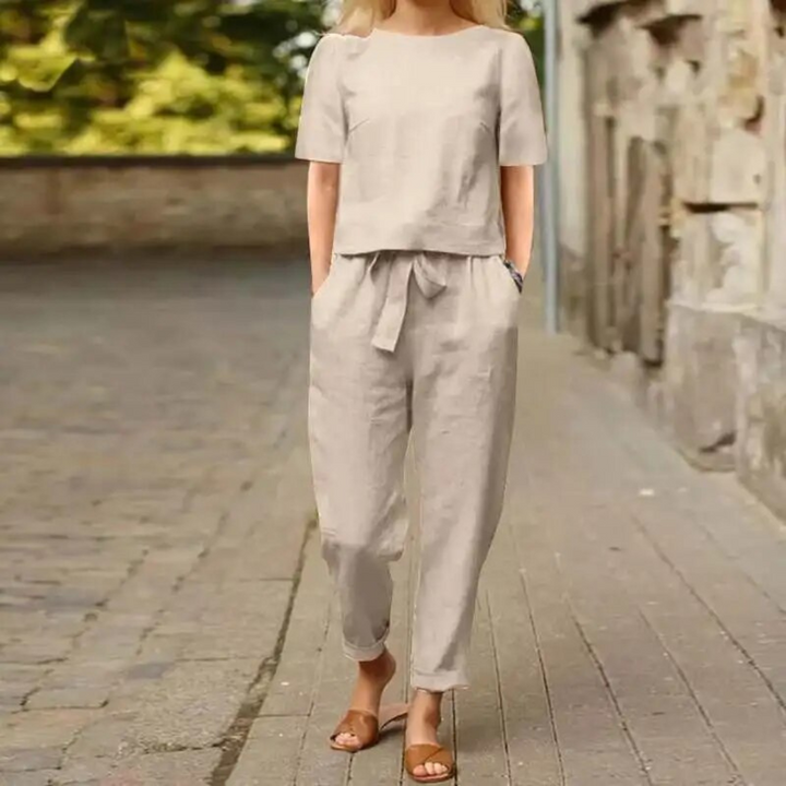 Elegant women's two-piece linen set. Perfect for summer casual wear or beach outfits. Comfortable and versatile.
