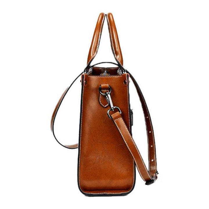 Versatile women's elegant leather tote handbag with zipper, a functional everyday shoulder bag organizer.