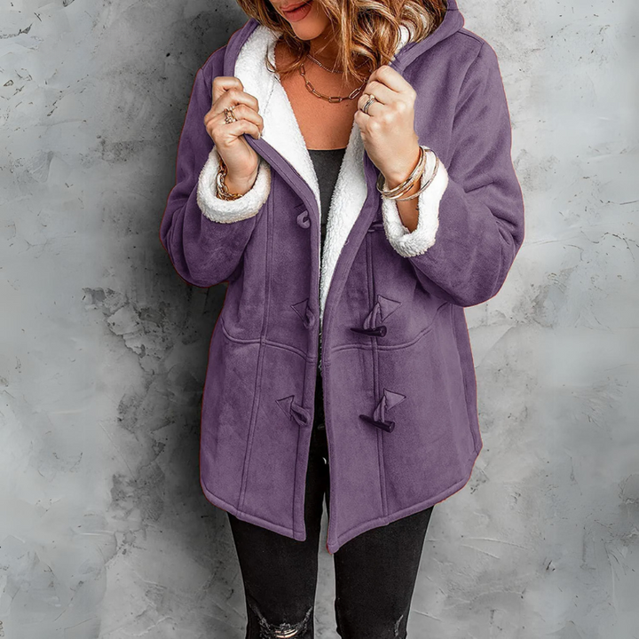 Stylish women's cozy Aspen fleece toggle coat, an essential winter outerwear jacket for cold weather.