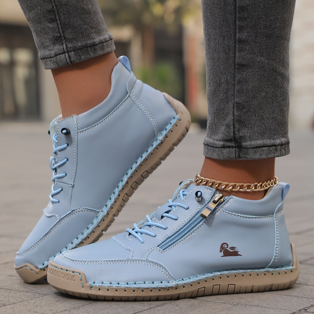 Comfy high-top sneakers for women, featuring zip closure & laces for a secure, wide fit.