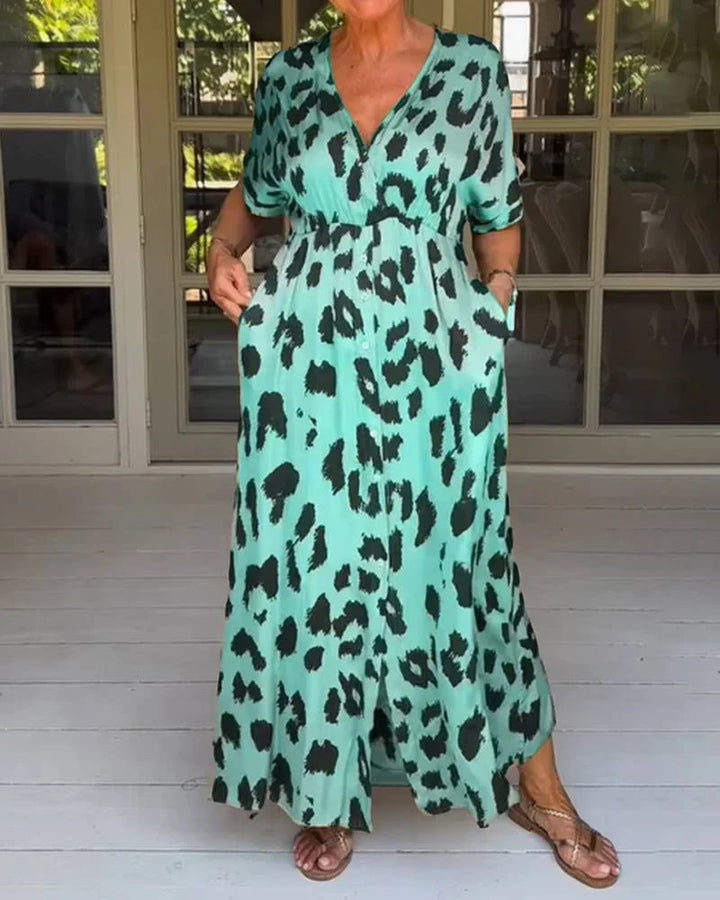 Long, elegant women's flowy maxi dress in bold leopard print with a v-neck. Comfortable summer animal print style.