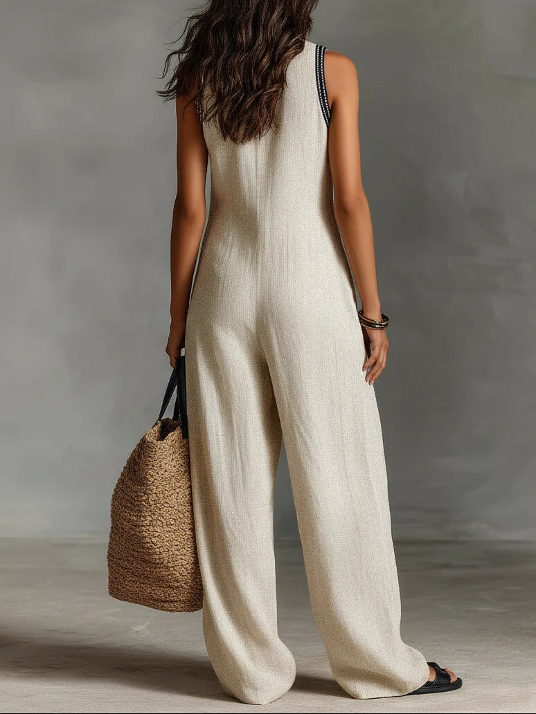 Versatile women's sleeveless high-neck jumpsuit in a modern design, ideal for elegant spring & summer outfits.