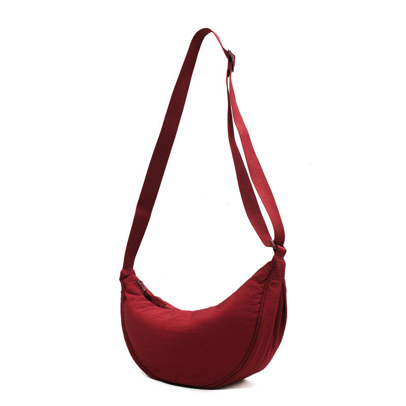 Classic Half Moon Crossbody Bag, an elegant women's purse suitable for work or leisure.