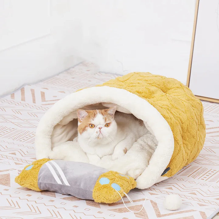 Plush cat sleeping bed with fun attached toy, providing a secure & warm spot for your pet's best rest.