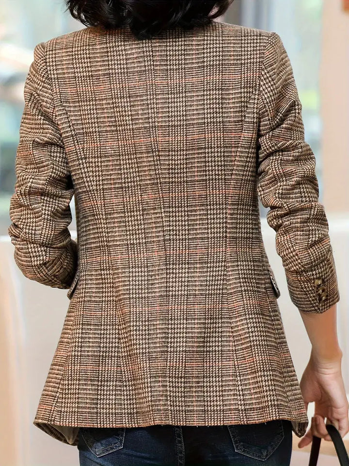 Stylish women's checked blazer, perfect for professional wear or smart casual. Features lapels & a single button.