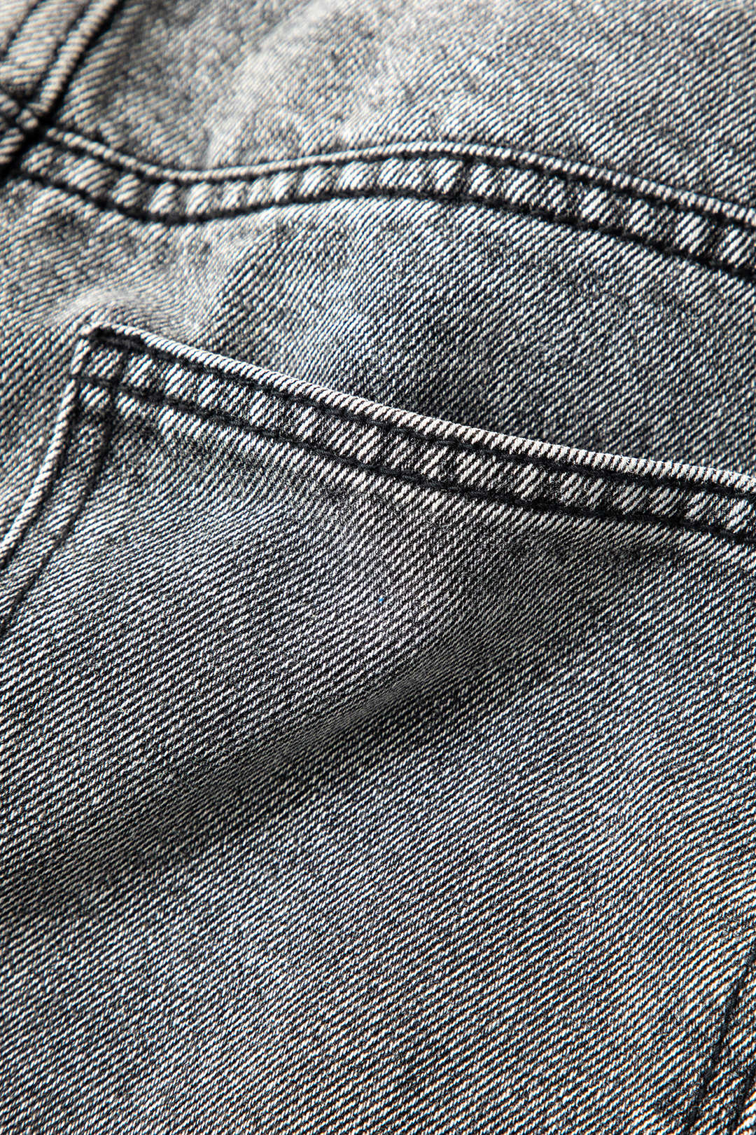 Modern women's high-waisted straight-leg jeans with a distinct asymmetric design. Light wash, comfortable, trendy.