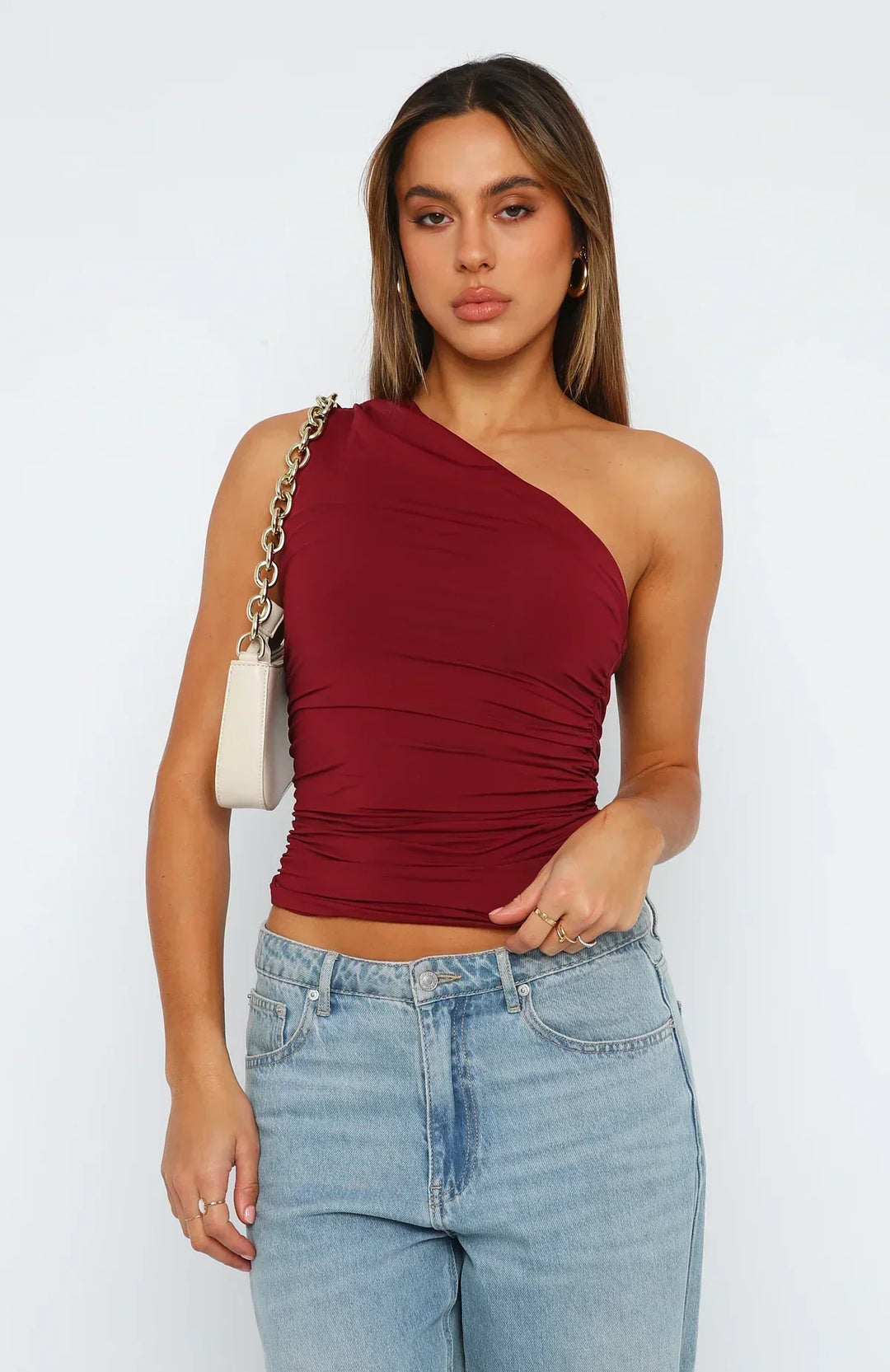 Women's burgundy ruched one-shoulder crop top, perfect for stylish parties & date nights.