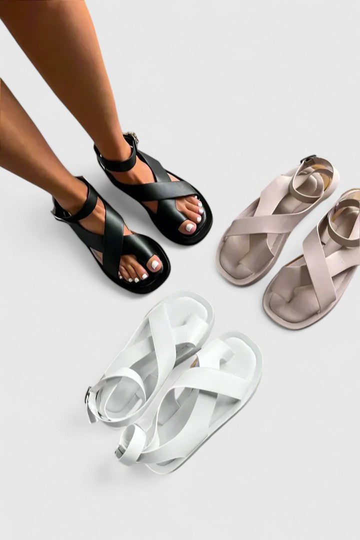 Women's elegant flat summer sandals; comfortable with adjustable straps.