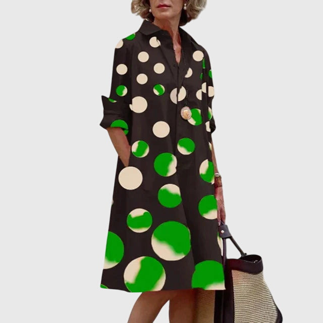 Full length shot of the women's casual elegant dress, focusing on its graceful flow and practical pockets.