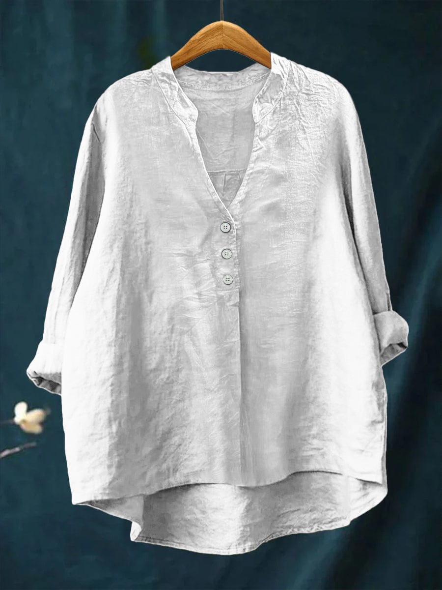 Versatile women's button-front casual blouse. Relaxed fit top with high-low hem, easily styled for everyday chic fashion.