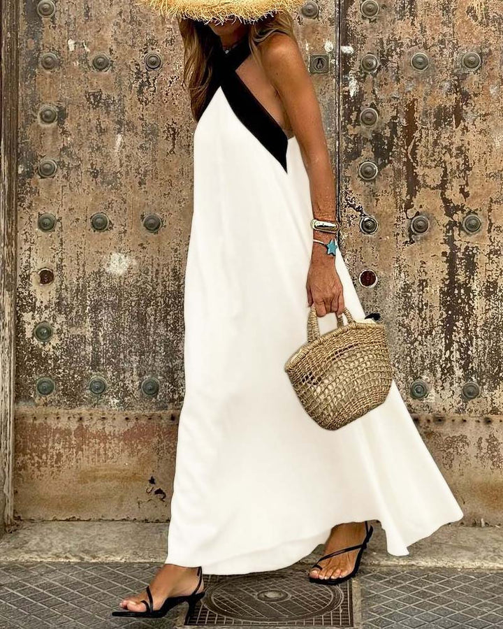 Sleeveless elegant women's maxi dress with a stylish cross neck. Perfect long dress for evening events.