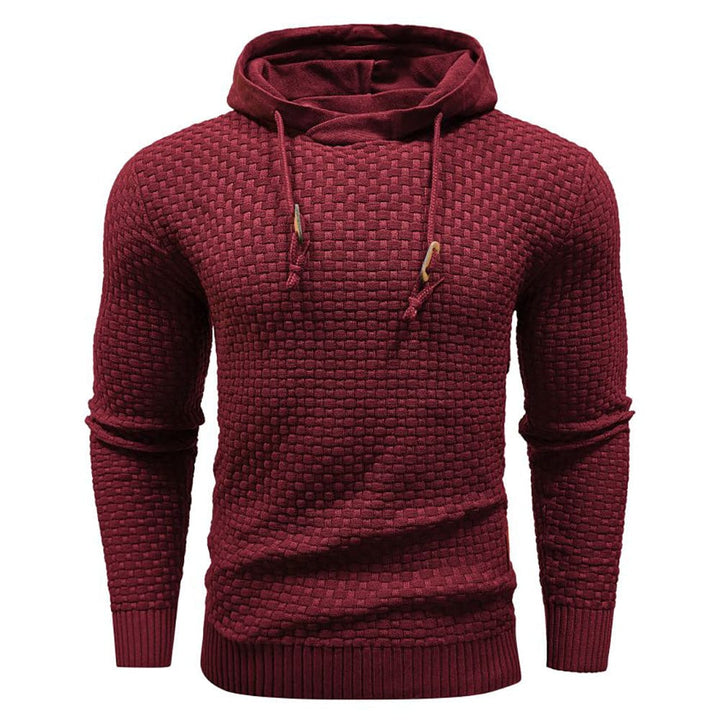 Neatly folded men's waffle hoodie, ready for travel or storage, emphasizing its cozy texture.