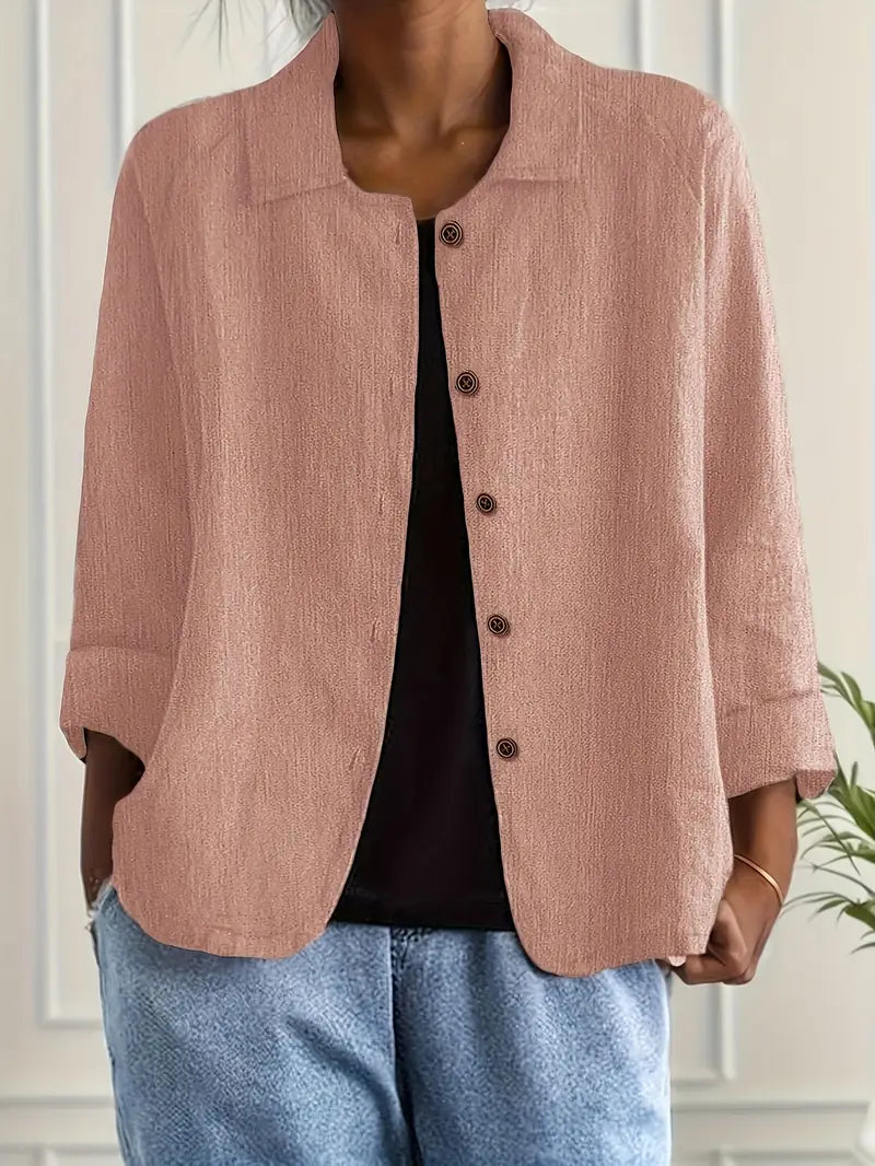 Stylish women's button-down blouse with a collar and 3/4 sleeves, perfect for smart casual looks.