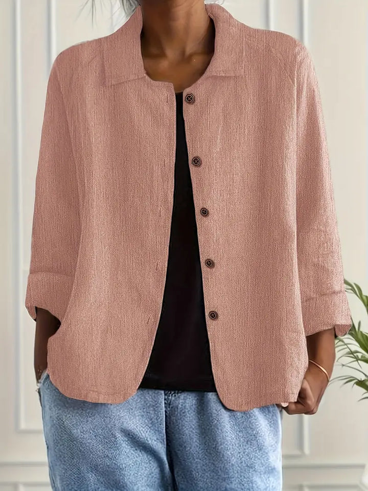 Stylish women's button-down blouse with a collar and 3/4 sleeves, perfect for smart casual looks.