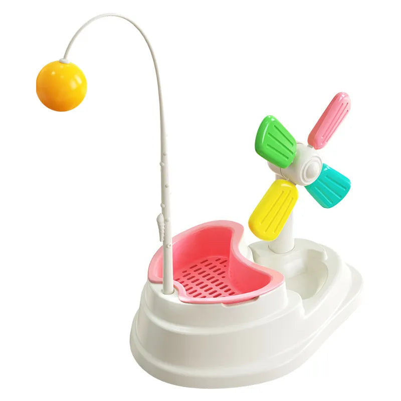 Happy cat batting an interactive windmill toy, stimulating mental focus & physical activity for pet fun.