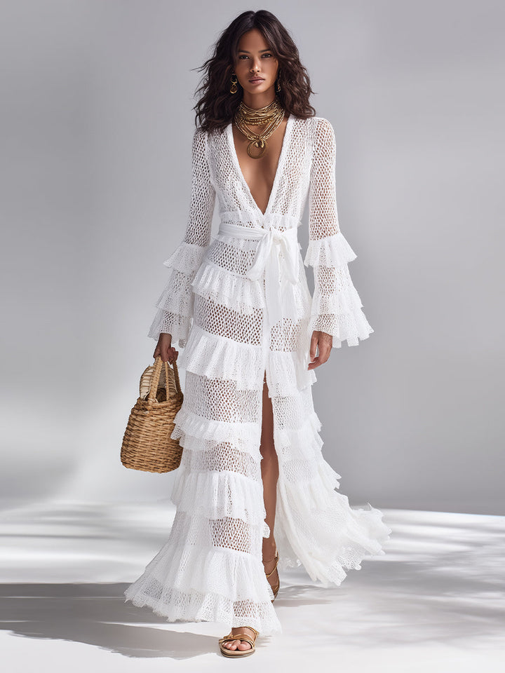 Women's white long sleeve knit cardigan, perfect for layering. Features a beautiful crocheted design & ruffles.
