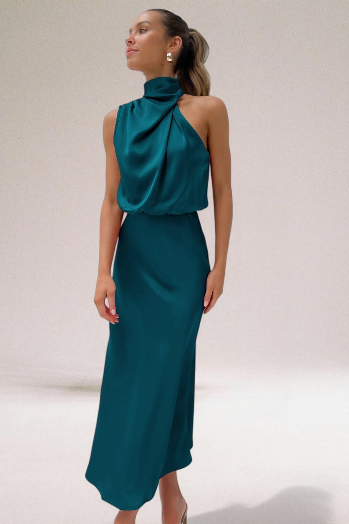 Elegant flowing maxi dress with a chic halter neck, ideal for formal wear & parties.
