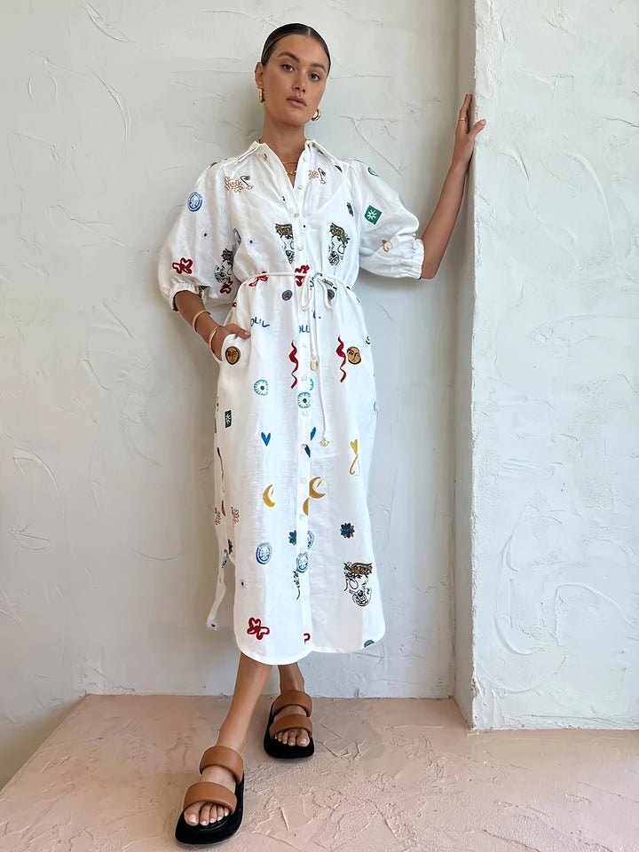 Beautiful women's floral print blouse featuring a stylish drawstring and long sleeves. A must-have elegant top.