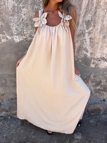 Soft, flowing women's maxi dress with chic bow straps & U-neck, great for warm weather & vacation wear.