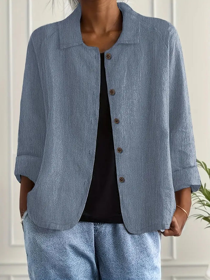Versatile women's 3/4 sleeve button-down top with collar, suitable for spring and fall outfits.