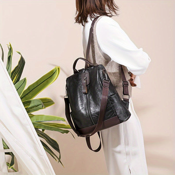 Elegant brown women's anti-theft backpack. Chic urban fashion security bag, perfect for stylish safety.
