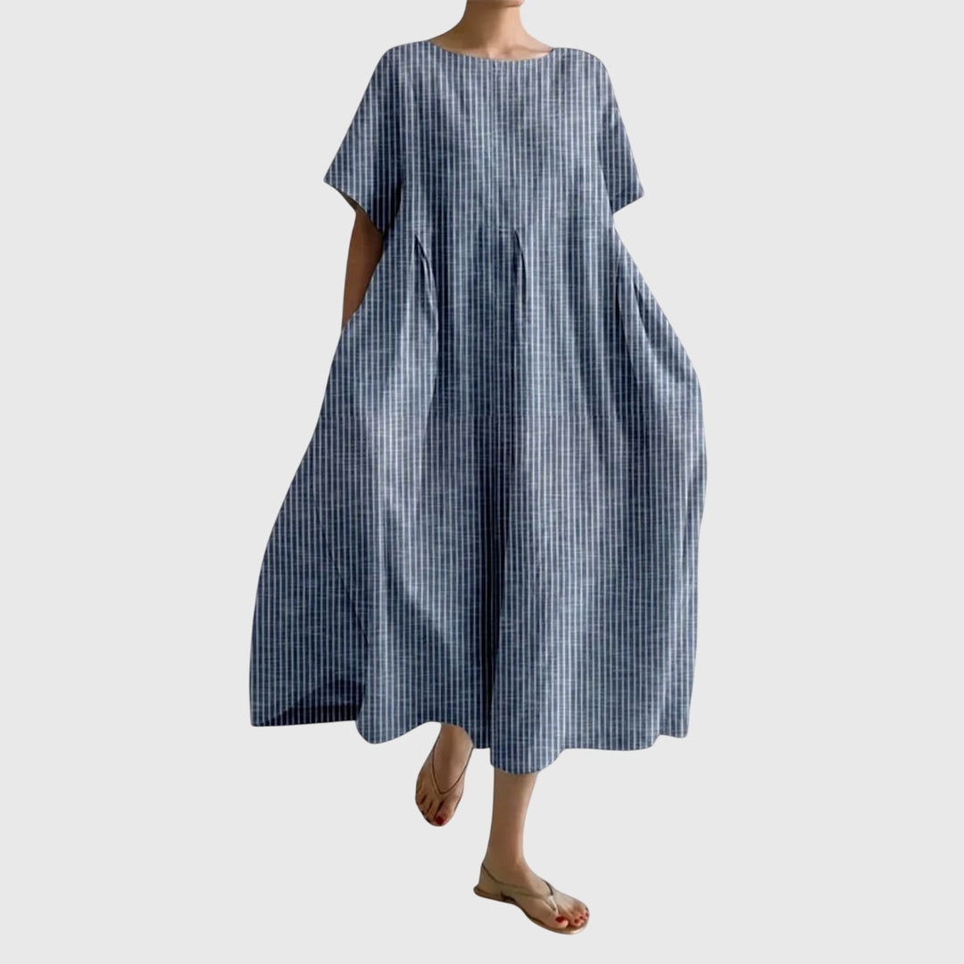 Flowy women's striped maxi dress. Elegant and versatile for casual wear, spring outings, or summer vacations.