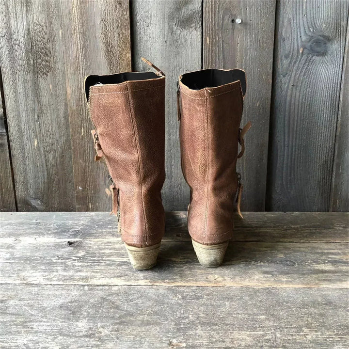 Women's brown mid-calf boots with side zip detail & block heel. Chic, versatile, and elegant fall/winter footwear.
