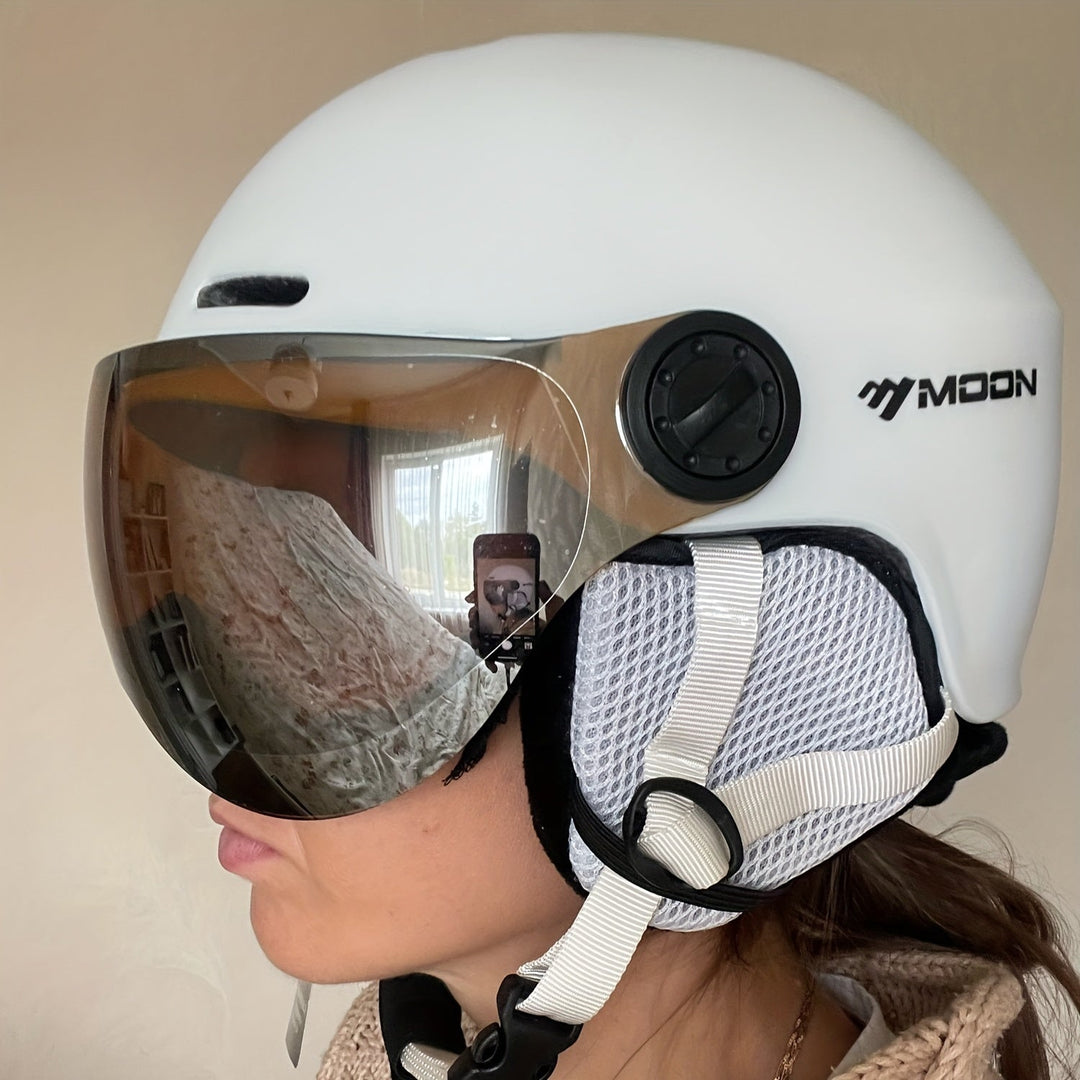 Skier wearing a protective ski helmet, enjoying mountain slopes. Safe winter sports headgear.