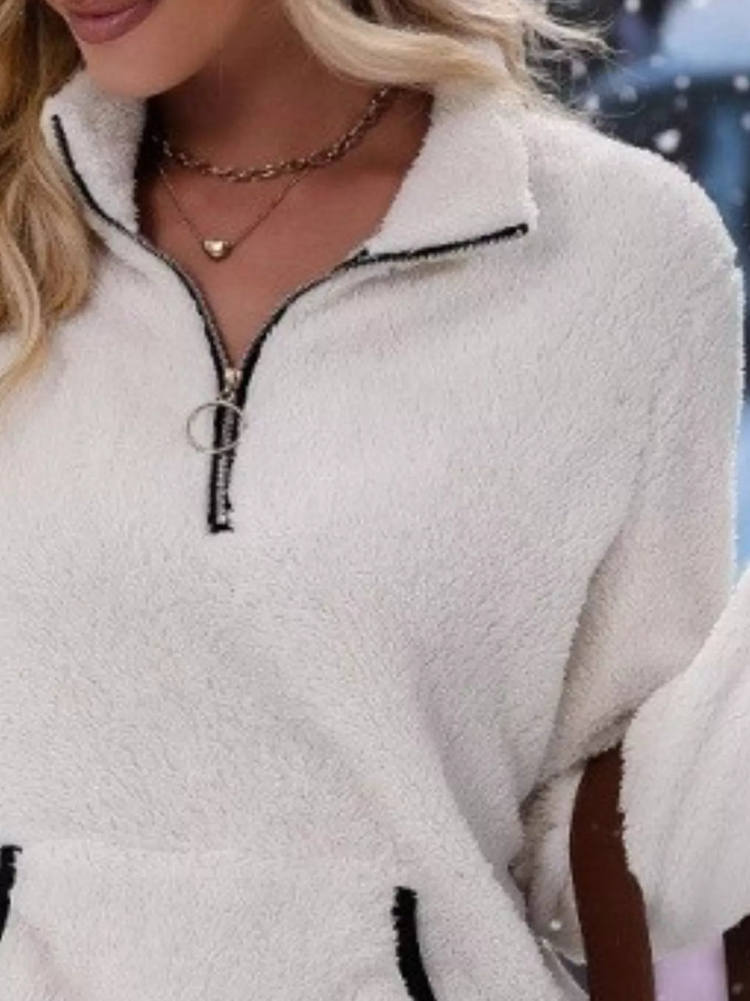 Stylish women's long sleeve half-zip sweater, great for casual autumn layering.