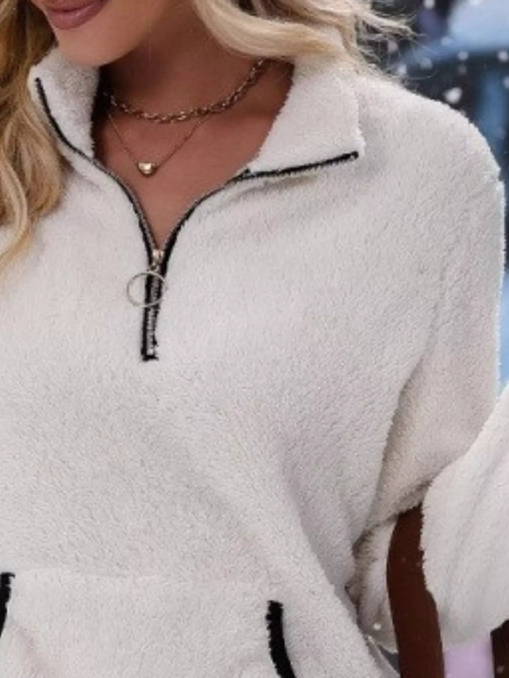 Stylish women's long sleeve half-zip sweater, great for casual autumn layering.