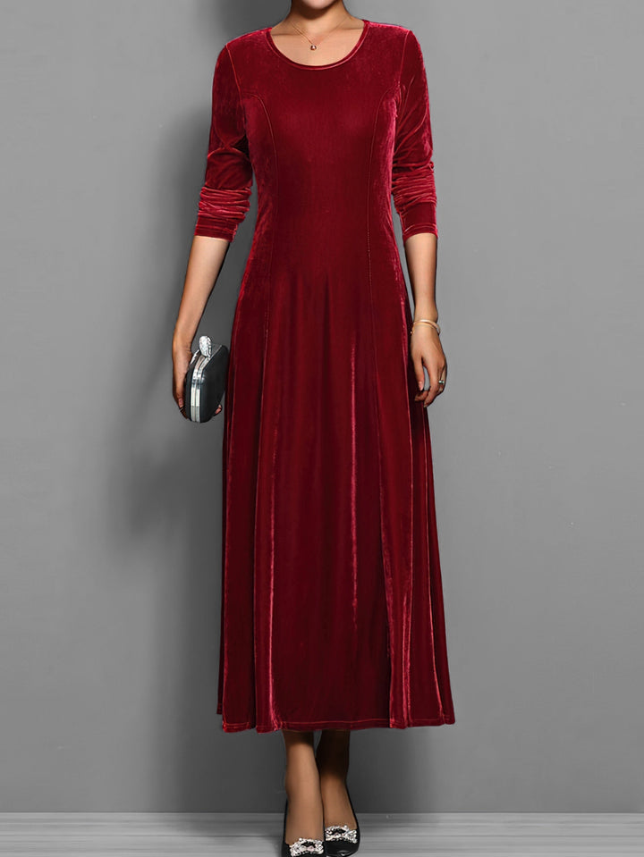 Stylish women's full-length flared maxi dress, an elegant long sleeve design suitable for spring events.