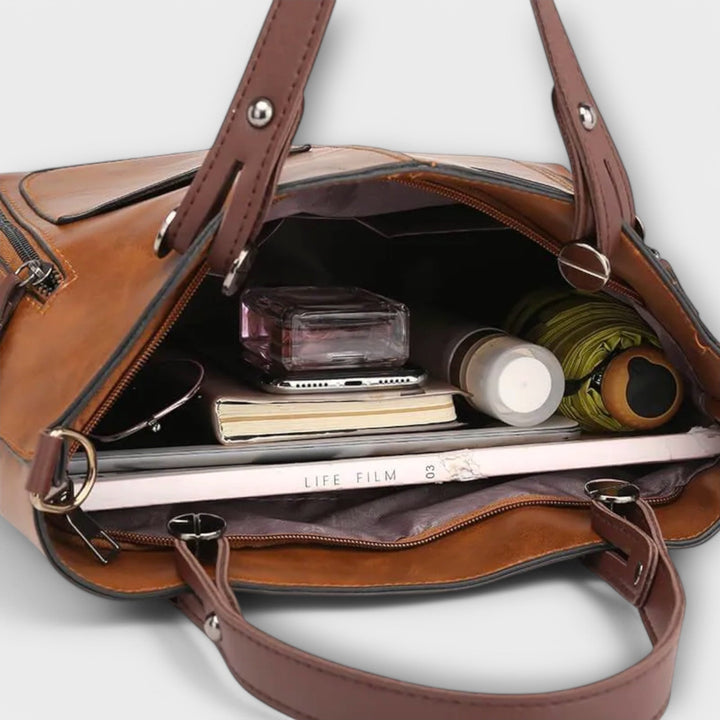 Practical women's classic black leather shoulder bag, a versatile handbag for everyday essentials.
