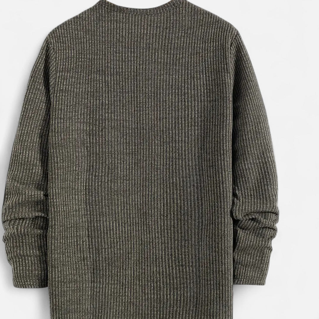 Men's versatile cable-knit henley. Long-sleeve pullover offering cozy comfort and stylish layering.