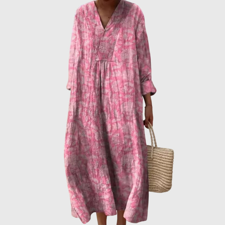 Flattering women's geometric print maxi dress with a modern design, perfect for elegant day to night wear.