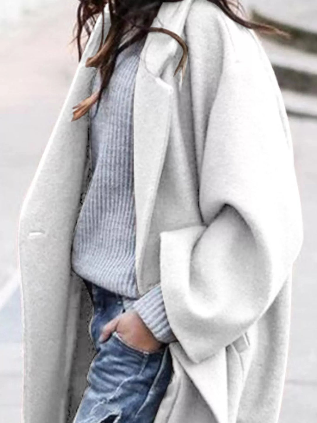 Black oversized women's long winter coat, designed for a comfortable relaxed fit and sleek style.