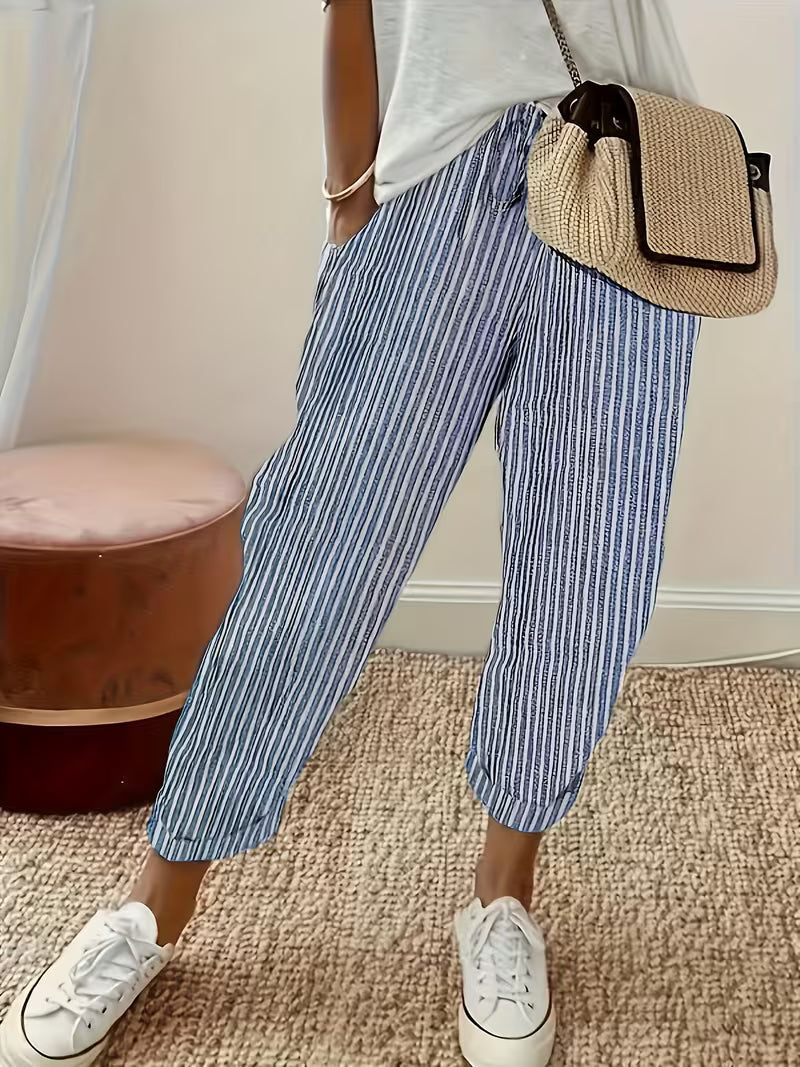 Women's vertical striped wide-leg casual pants with elastic waist for comfortable, effortless everyday style.
