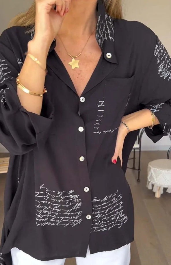 Front view of women's oversized button-up shirt with script print. Trendy, relaxed fit long sleeve for casual chic.