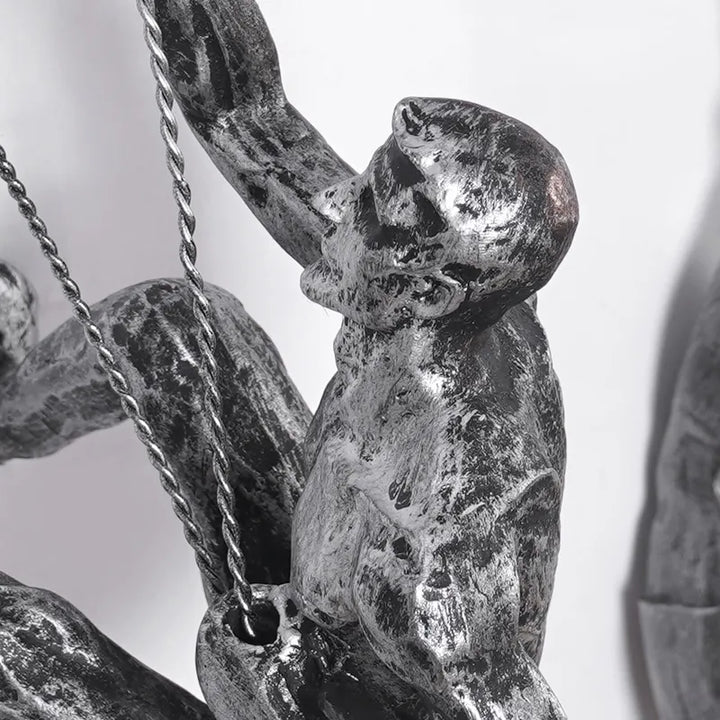 Dark bronze climbing figures wall sculpture set, contemporary living room decor.